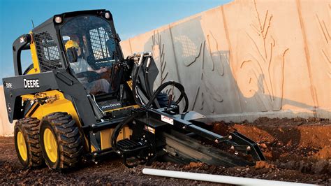 skid steer digging a ditch|digging a drainage ditch.